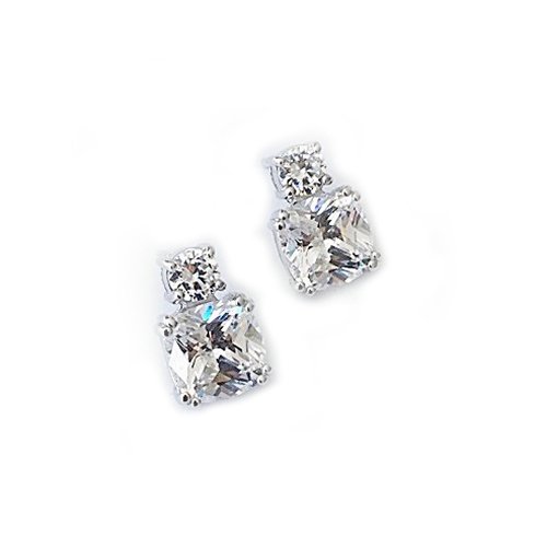 Meghan Markle inspired diamond simulant earrings featuring a large cushion cut diamond simulant stone with a smaller brilliant cut stone, both double 4 prong set in sterling silver with white gold plating