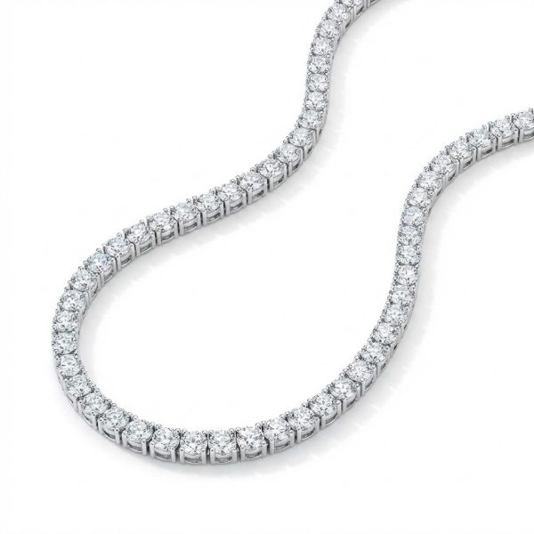 A timeless brilliant-cut tennis necklace, diamond simulants (4mm each), prong-set in sterling silver with rhodium plating. A refined statement of elegance, designed to capture brilliance from every angle.