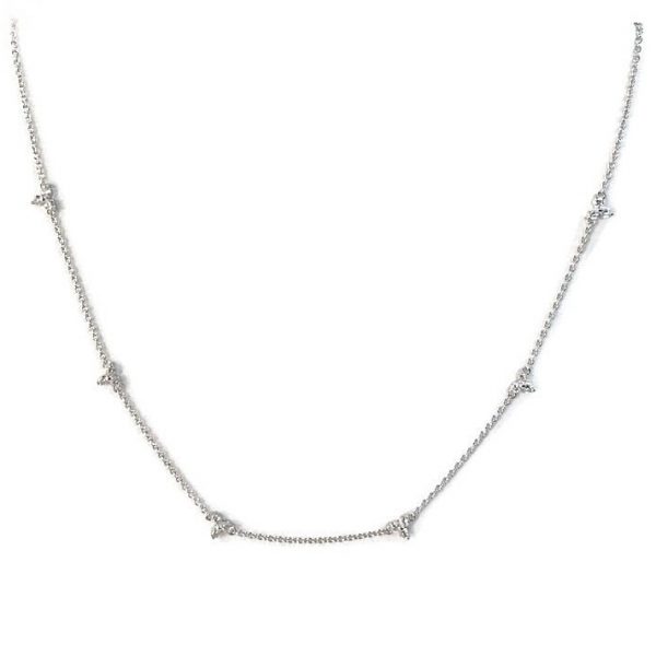 elegant piece features dainty diamond trios strung along a delicate Silver with 14K gold plated cable chain.
