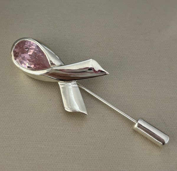 Breast Cancer Awareness Lapel Pin in sterling silver with rhodium plating, featuring a 12x8mm pink teardrop lab-created simulant in a ribbon design, 5.5 cm in length.