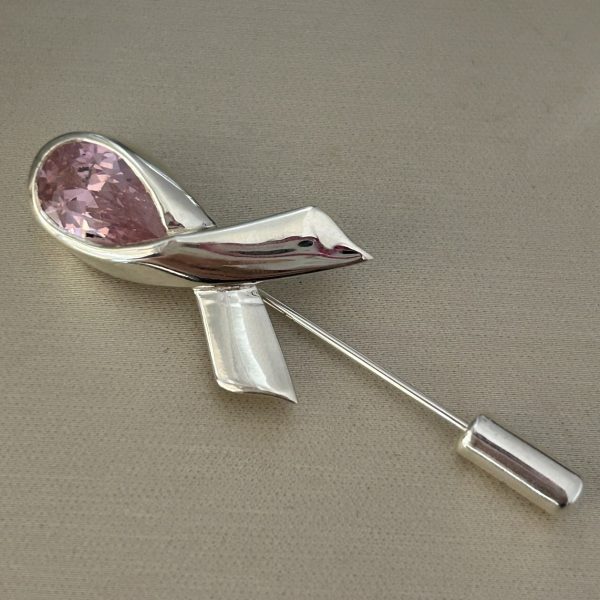 Breast Cancer Awareness Lapel Pin in sterling silver with rhodium plating, featuring a 12x8mm pink teardrop lab-created simulant in a ribbon design, 5.5 cm in length.