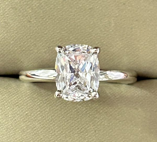 Solitaire Ring with 9x7mm cushion-cut lab-created diamond simulant in a four-prong setting, crafted in sterling silver with rhodium plating.